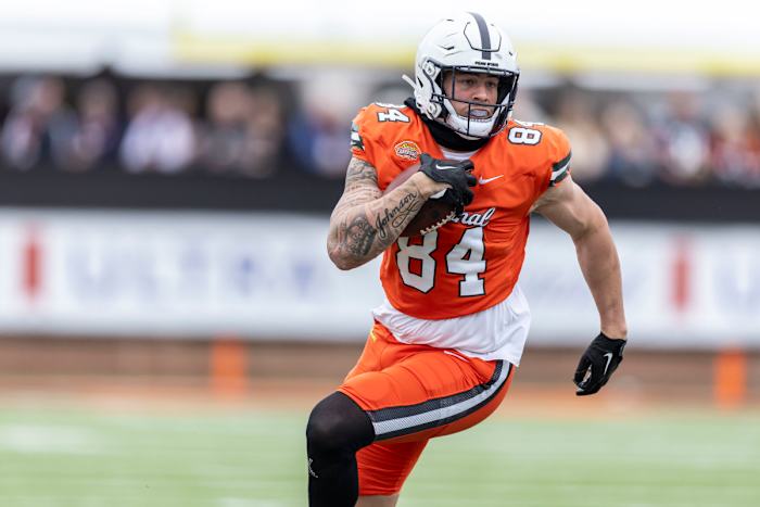 National tight end Theo Johnson of Penn State (84) runs after a catch during the first half of the 2024 Senior Bowl.
